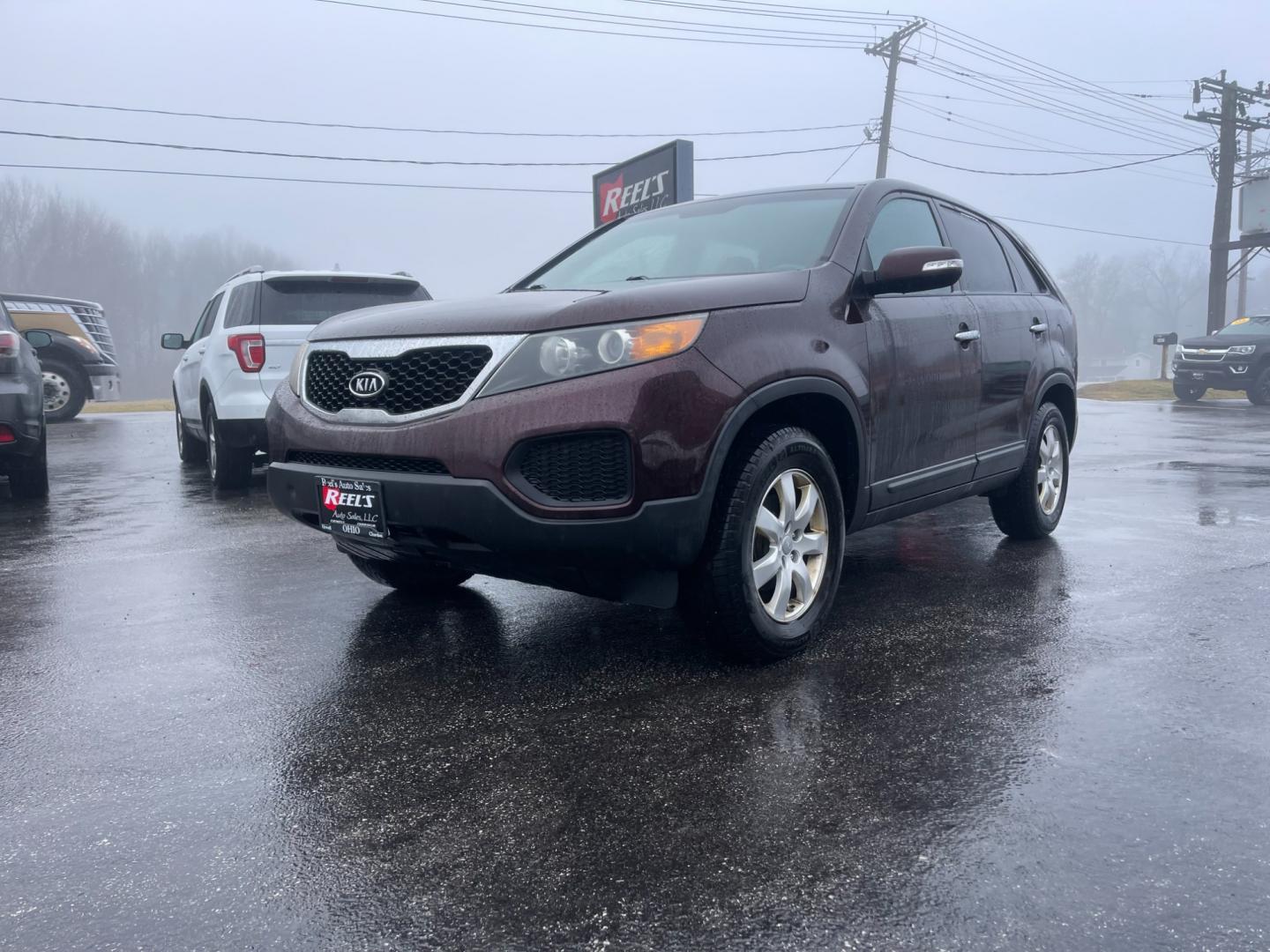 2011 Purple /Black Kia Sorento LX 2WD (5XYKT3A17BG) with an 2.4L I4 DOHC 16V engine, 6-Speed Automatic transmission, located at 547 E. Main St., Orwell, OH, 44076, (440) 437-5893, 41.535435, -80.847855 - Photo#0